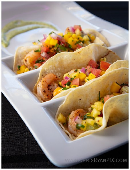 delicious shrimp tacos on modern serving tray with sauce