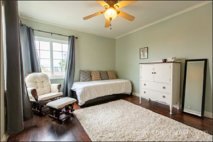 Interior Real Estate Photo of Bedroom with carpet and sunlight