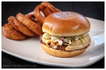 food photography of delicious hamburger with onion rings