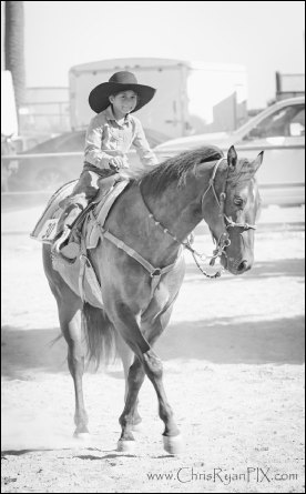 Young Cowboy Riding Horse at Ranch (ChrisRyanPIX)