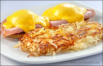 delicious eggs benedict with hash browns for breakfast