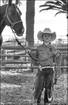 Equine Photograph of Young Wrangler with Horse at Rodeo (ChrisRyanPIX)