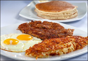 food photography of big breakfast featuring corned beef and hash with pancakes